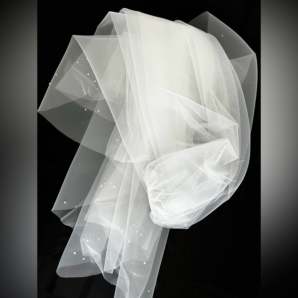 Elegant Fingertip Veil 51” long
With 27” Blusher 
Pearls & Swarovski crystals